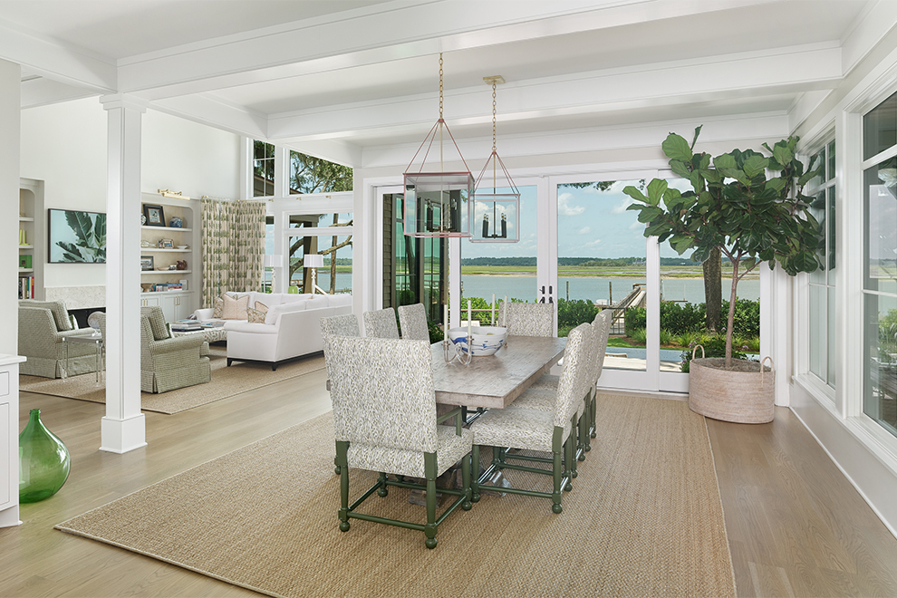 Architectural home renovation dining space with natural light and water views by Kiawah Island renovation architect Marc Camens