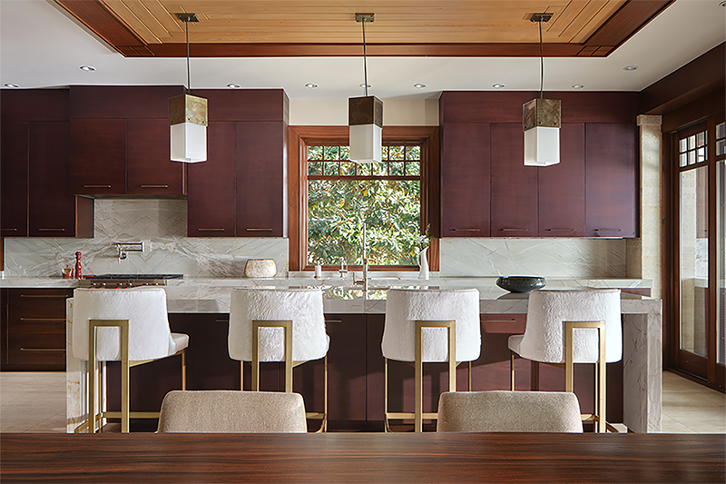 Sophisticated kitchen in a desert craftsman home with mahogany cabinetry, marble counters, and architectural home design that blends form and function