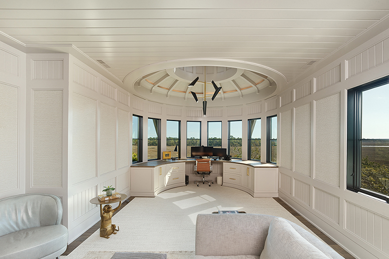 Circular office in a custom home with panoramic window placement exemplifies light-focused architecture and a view-driven design.