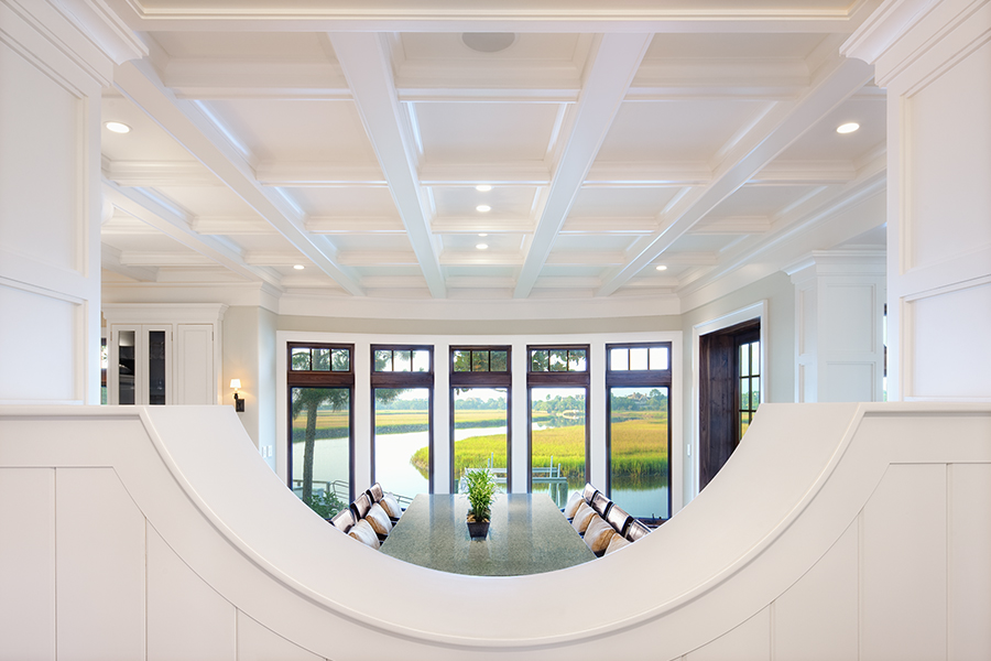 Intentional window placement in this custom dining room creates framed views and brings the landscape into the architecture.