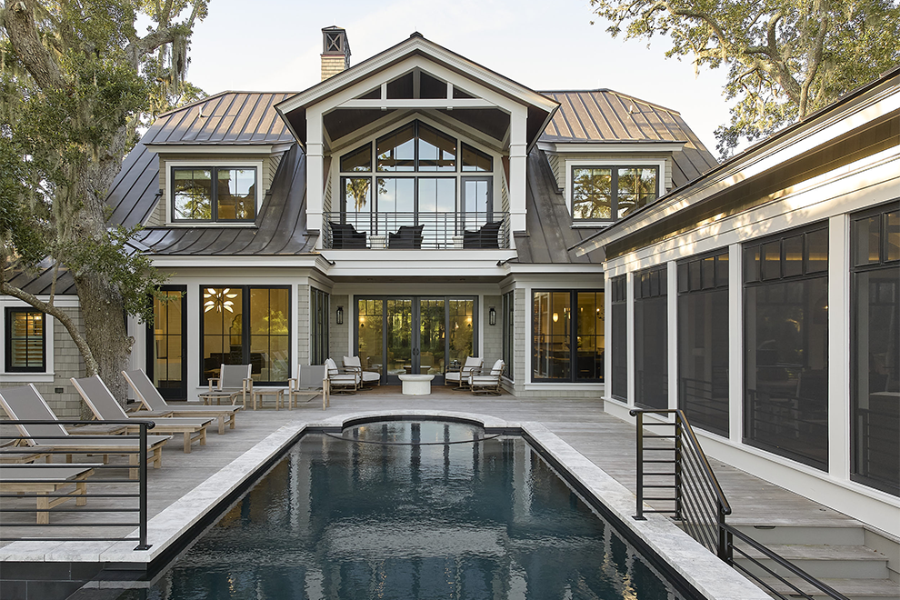 Luxury custom home with infinity pool seamlessly integrated into the residential architecture process by Marc Camens.
